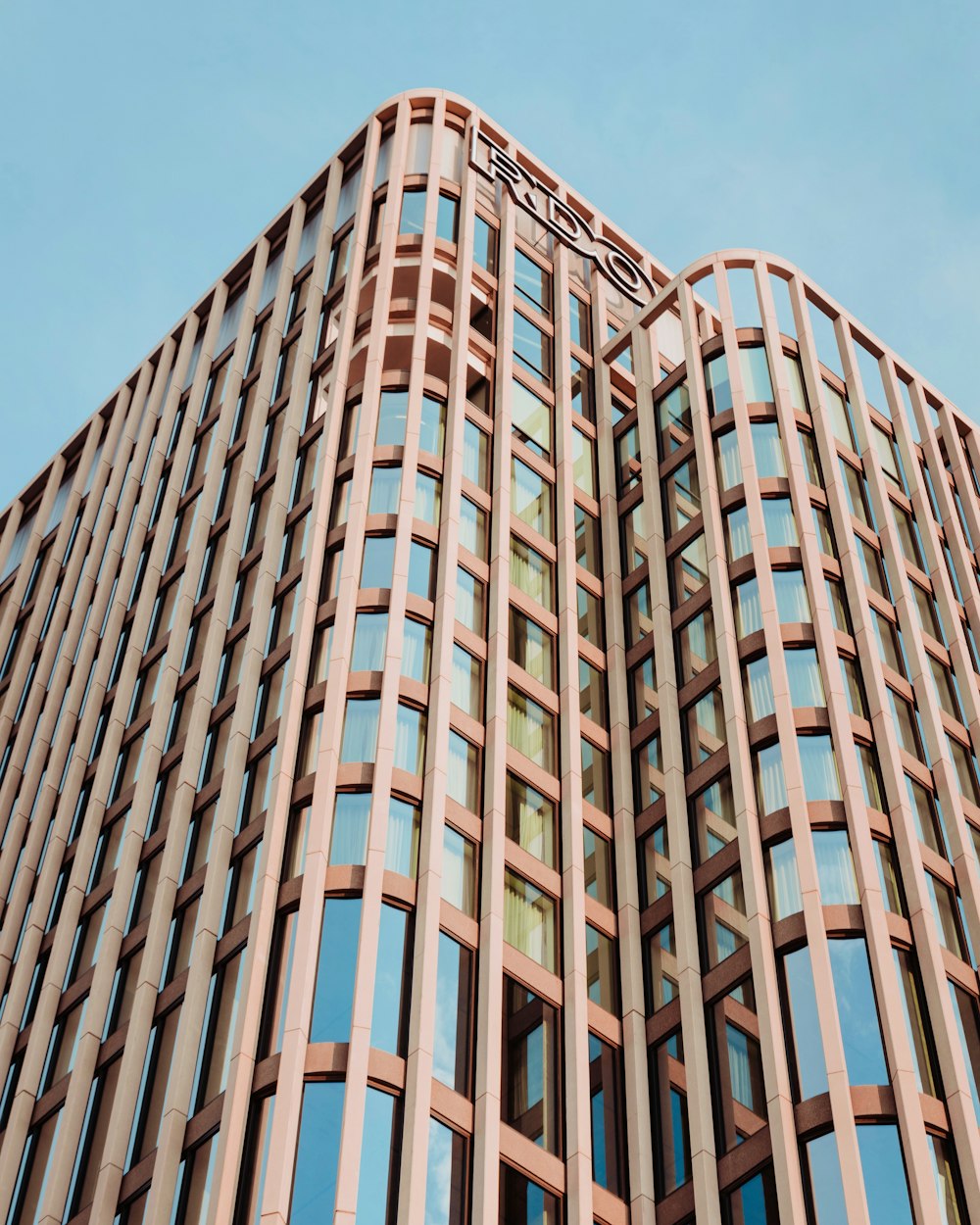 a tall building with lots of windows on top of it