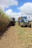 a couple of trucks that are in the dirt