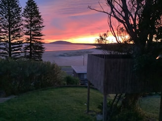 A stunning beachfront property at sunset.