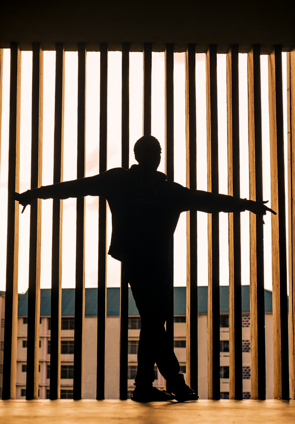 a man standing in front of a jail cell