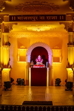 Jairaj Kalsy performing in traditional attire, surrounded by soft golden light that evokes a serene, sacred atmosphere.