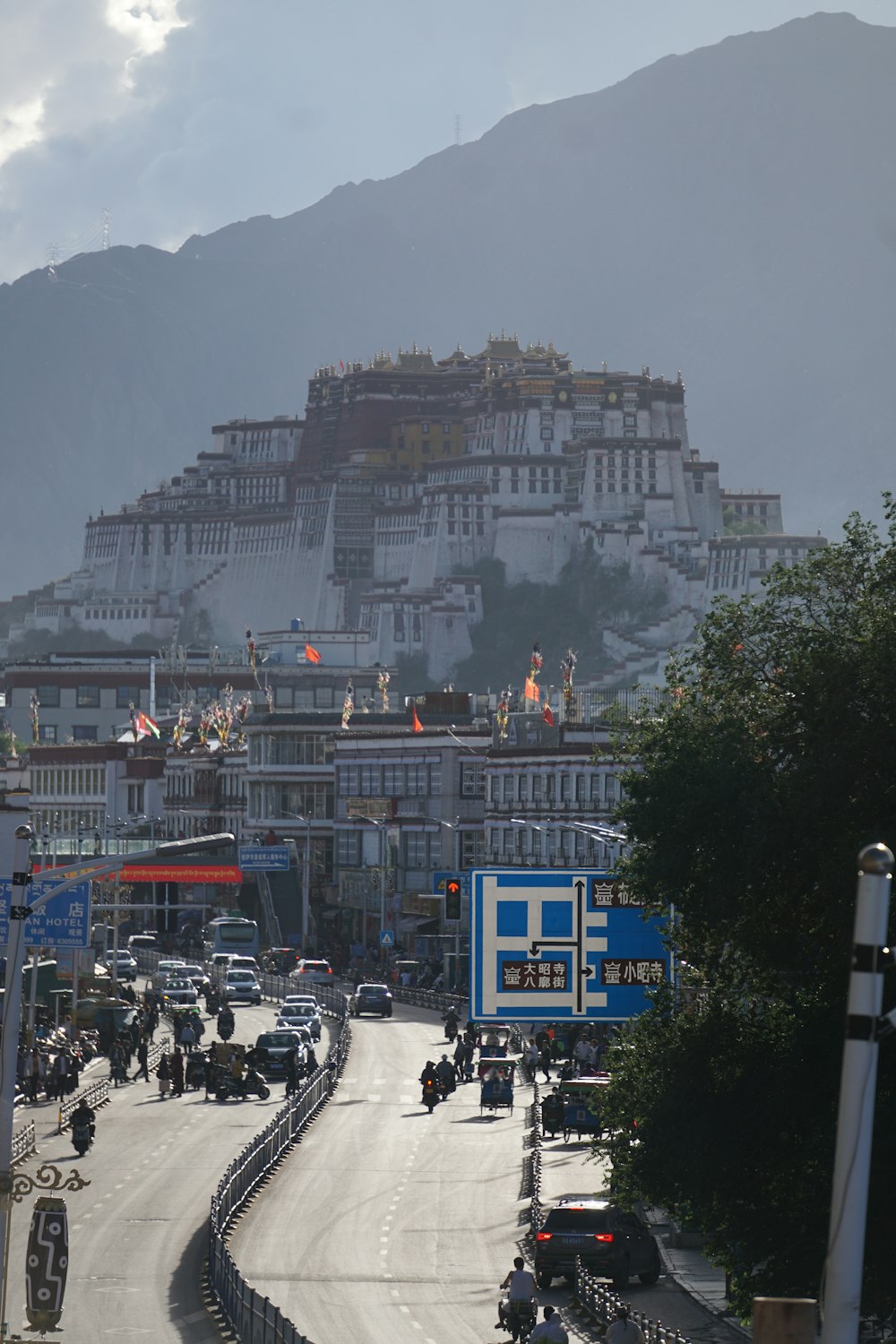 a city street with a mountain in the background