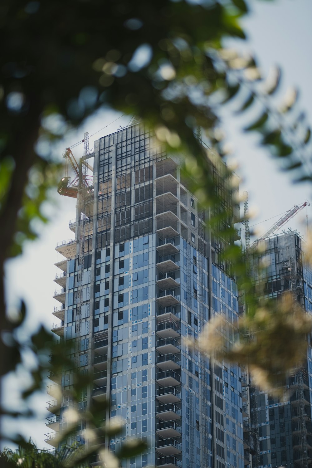 a tall building with a crane on top of it