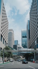 a city street with cars driving down it