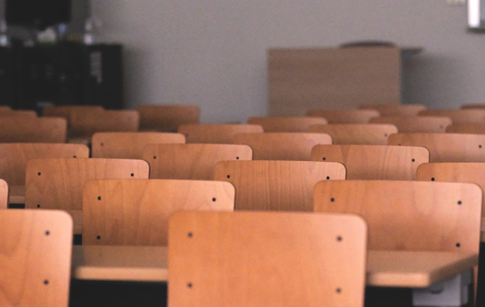 a row of wooden chairs in a room