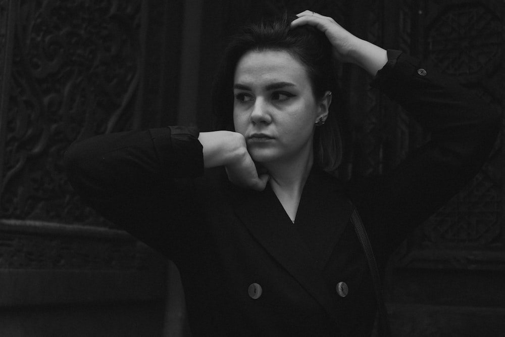 a black and white photo of a woman in a suit