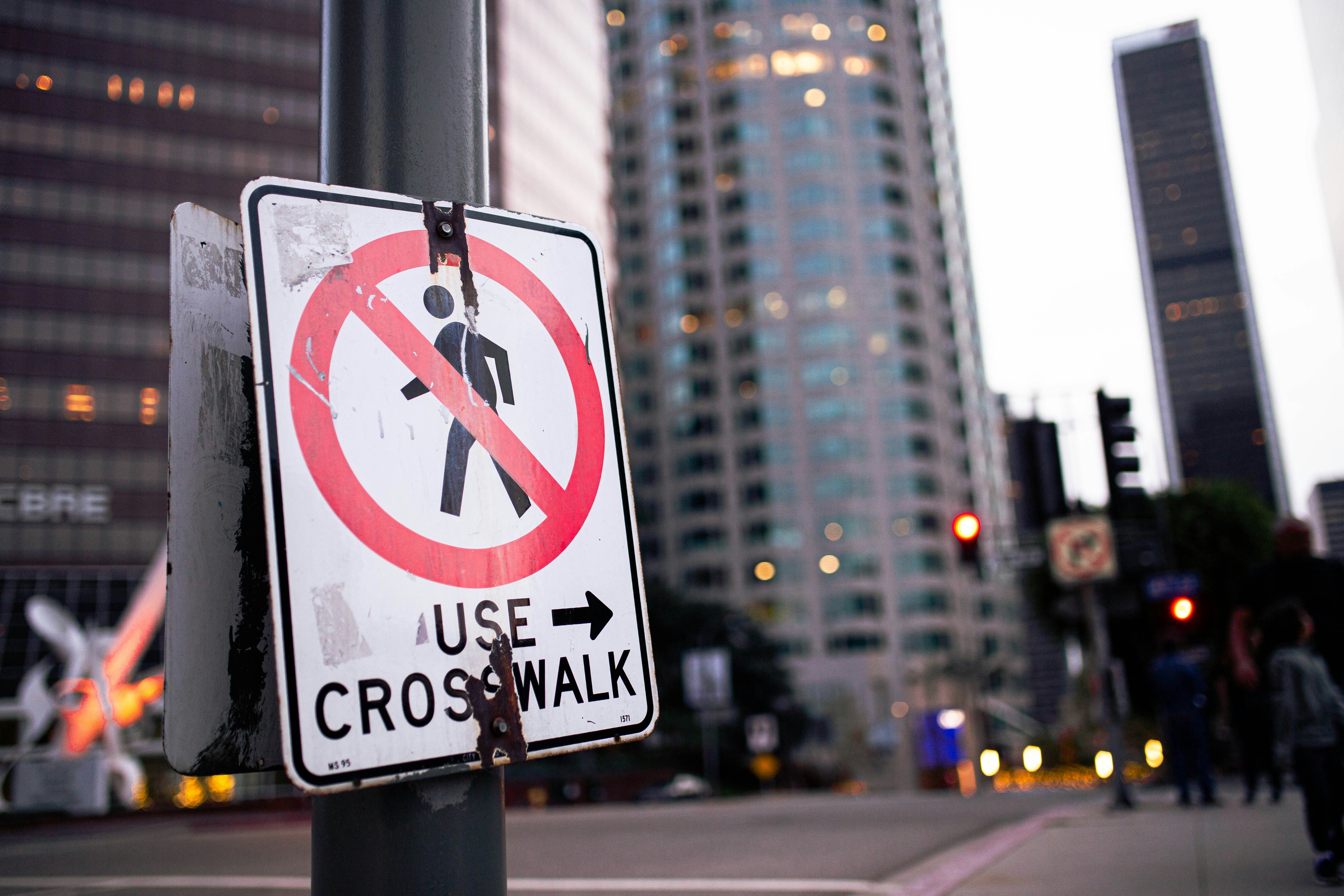 a street sign on a pole on a city street