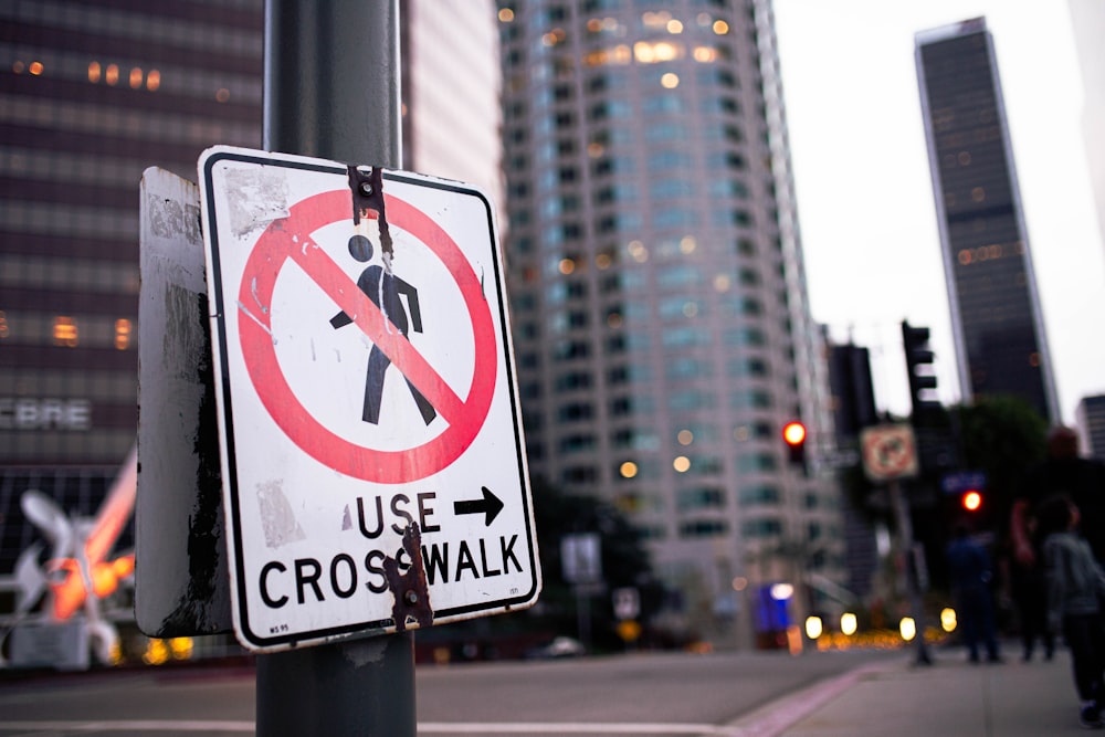 a street sign on a pole on a city street