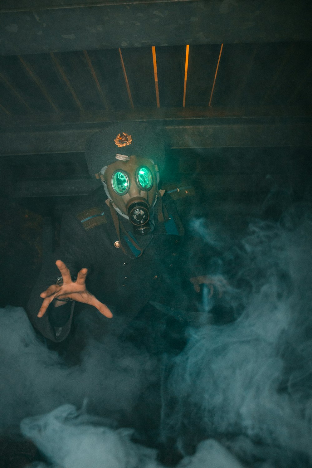 a person in a gas mask in smoke