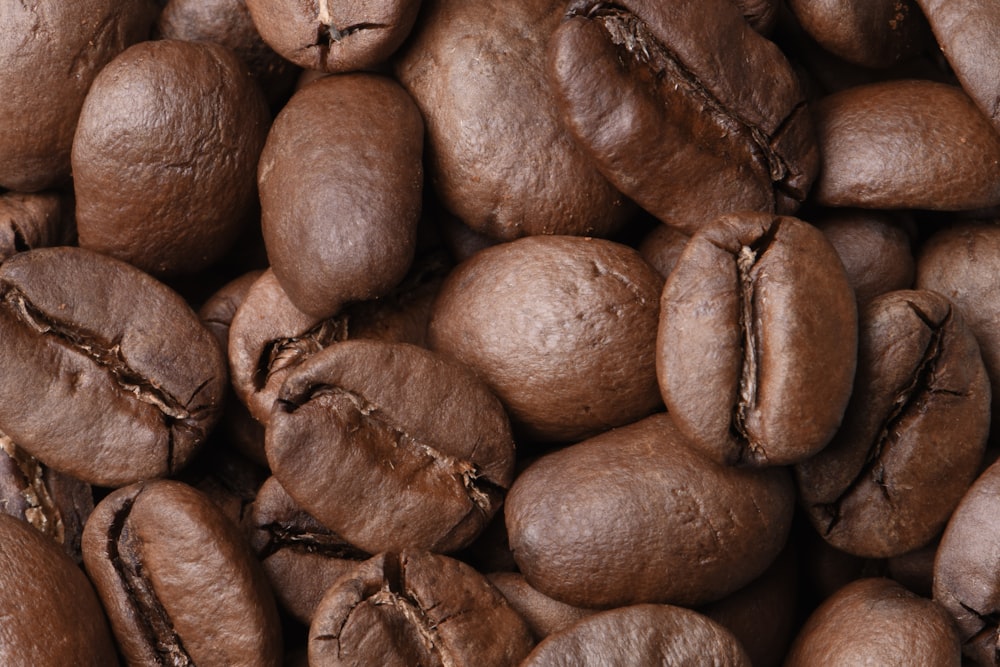 a pile of coffee beans that are brown