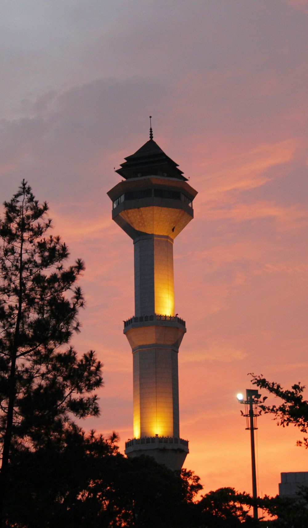 a tall tower with a light on top of it