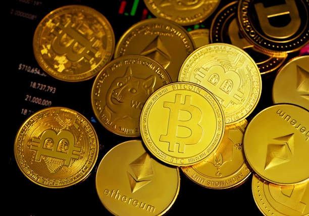 a pile of gold bitcoins sitting on top of each other