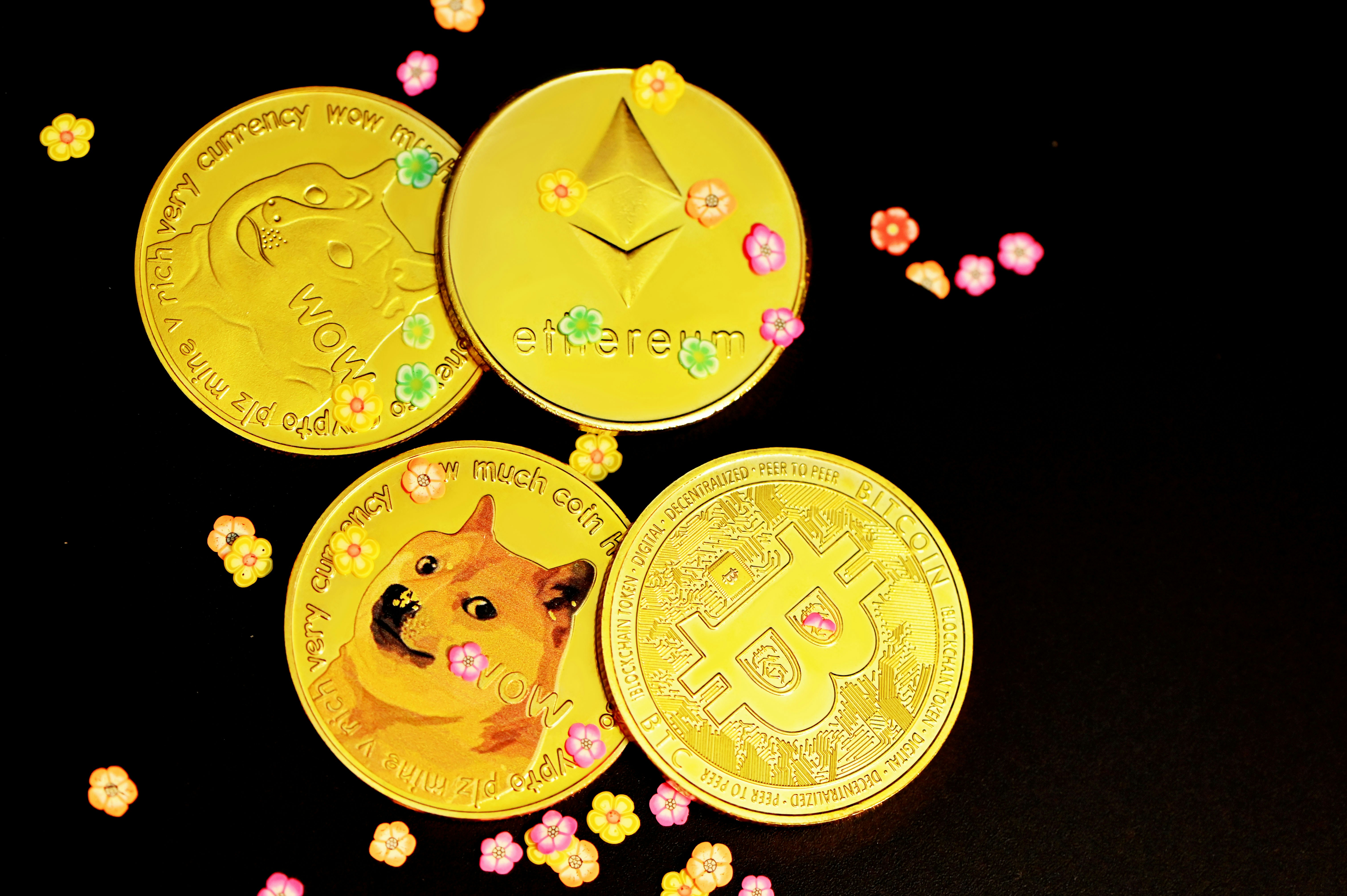 Crypto coins surrounded by little flowers