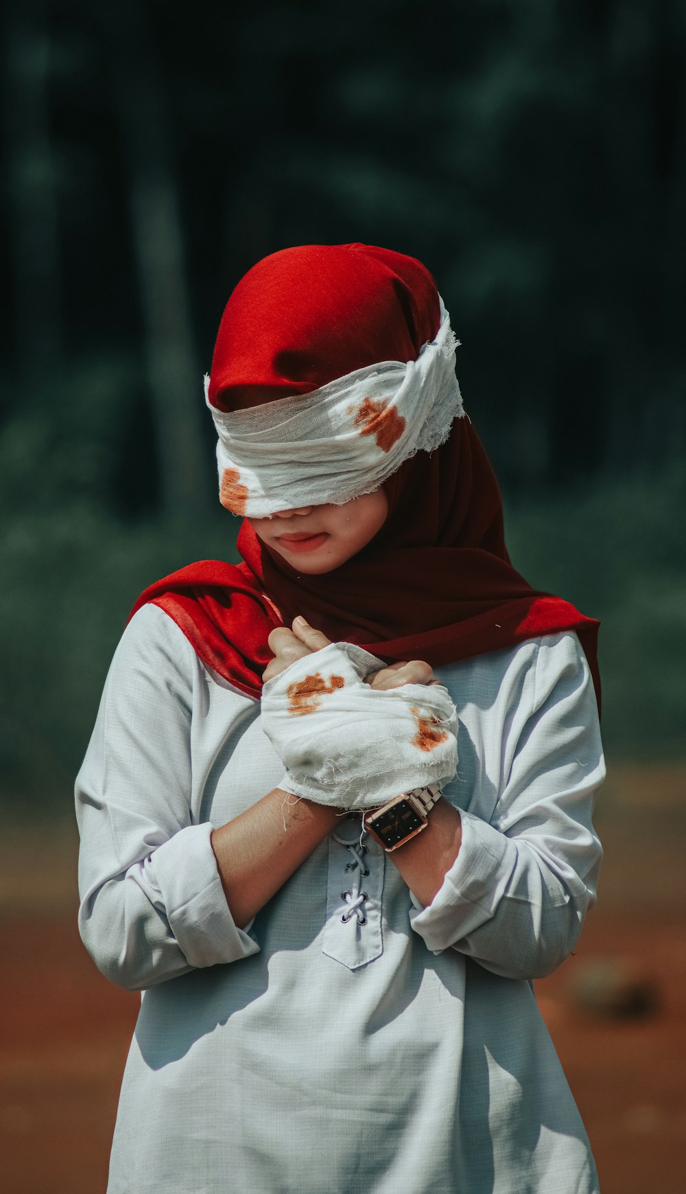 a woman wearing a red and white outfit and a red and white scarf