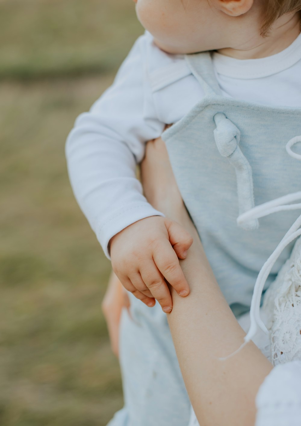 a woman holding a baby in her arms