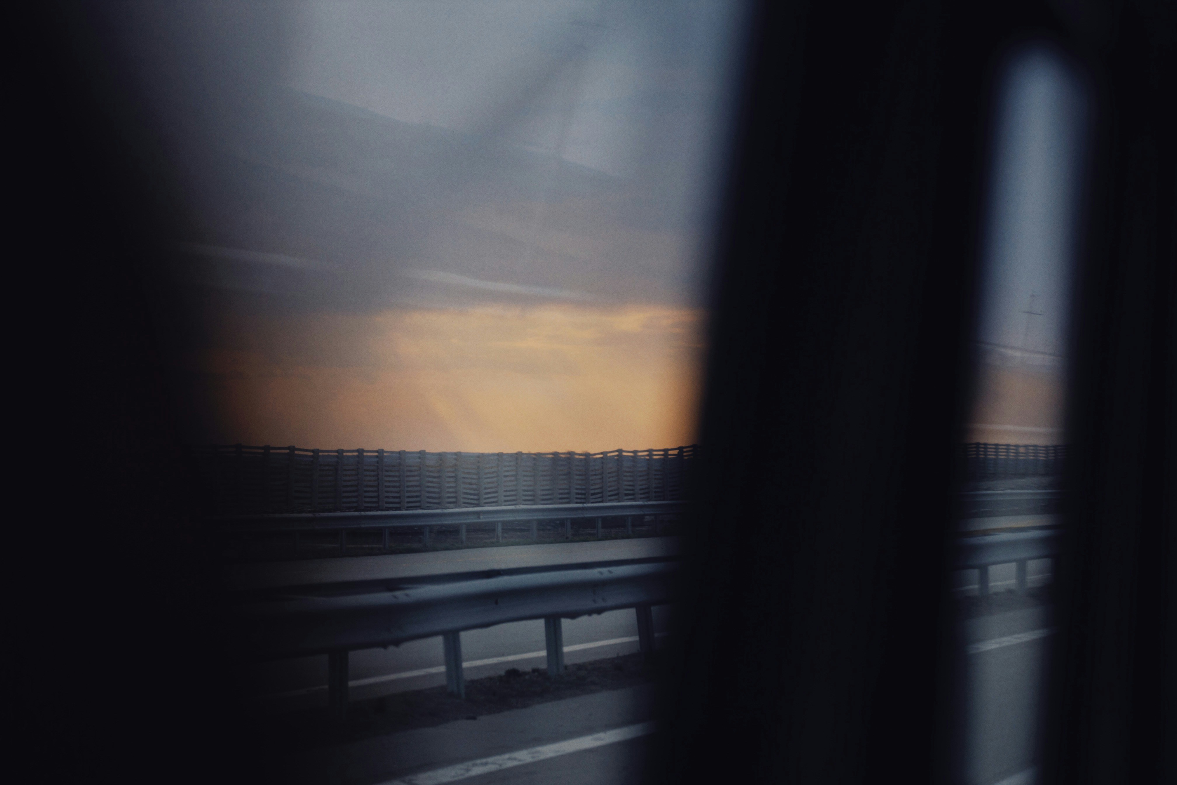 a view of a highway from a train window