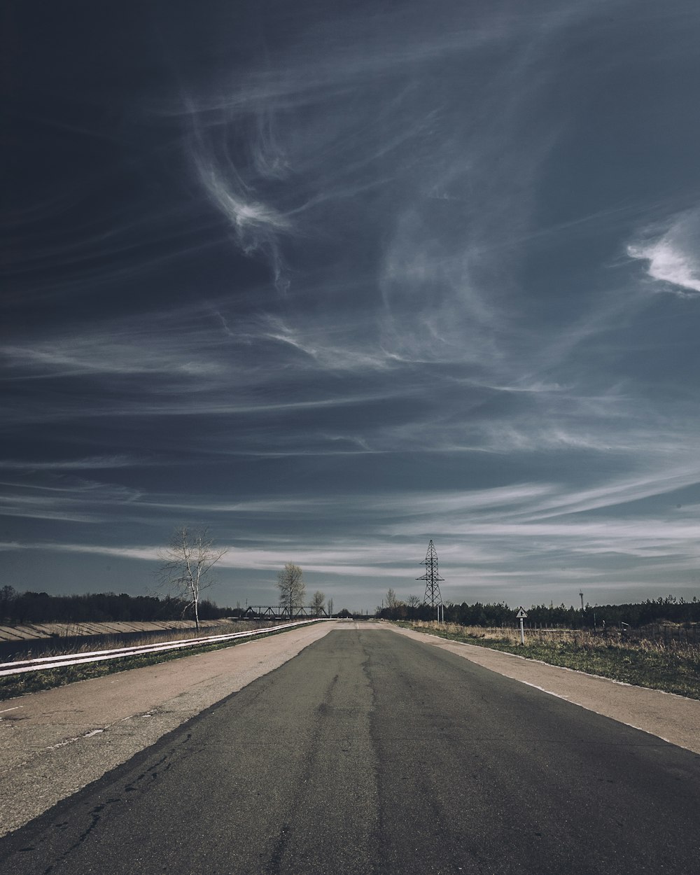 a long empty road in the middle of nowhere