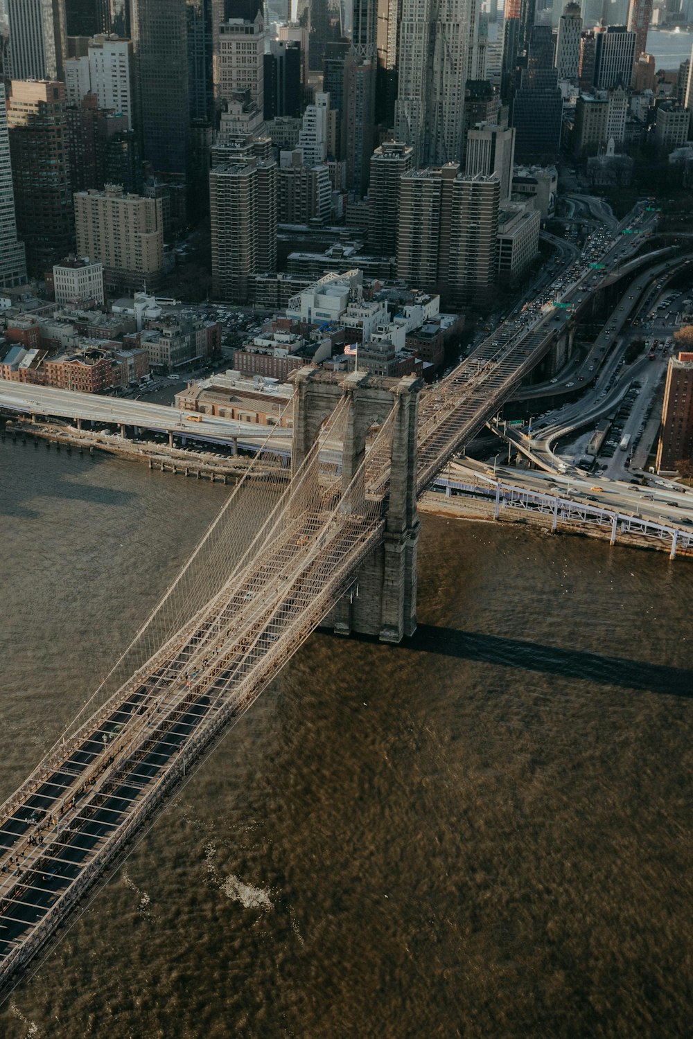 an aerial view of a bridge in a city