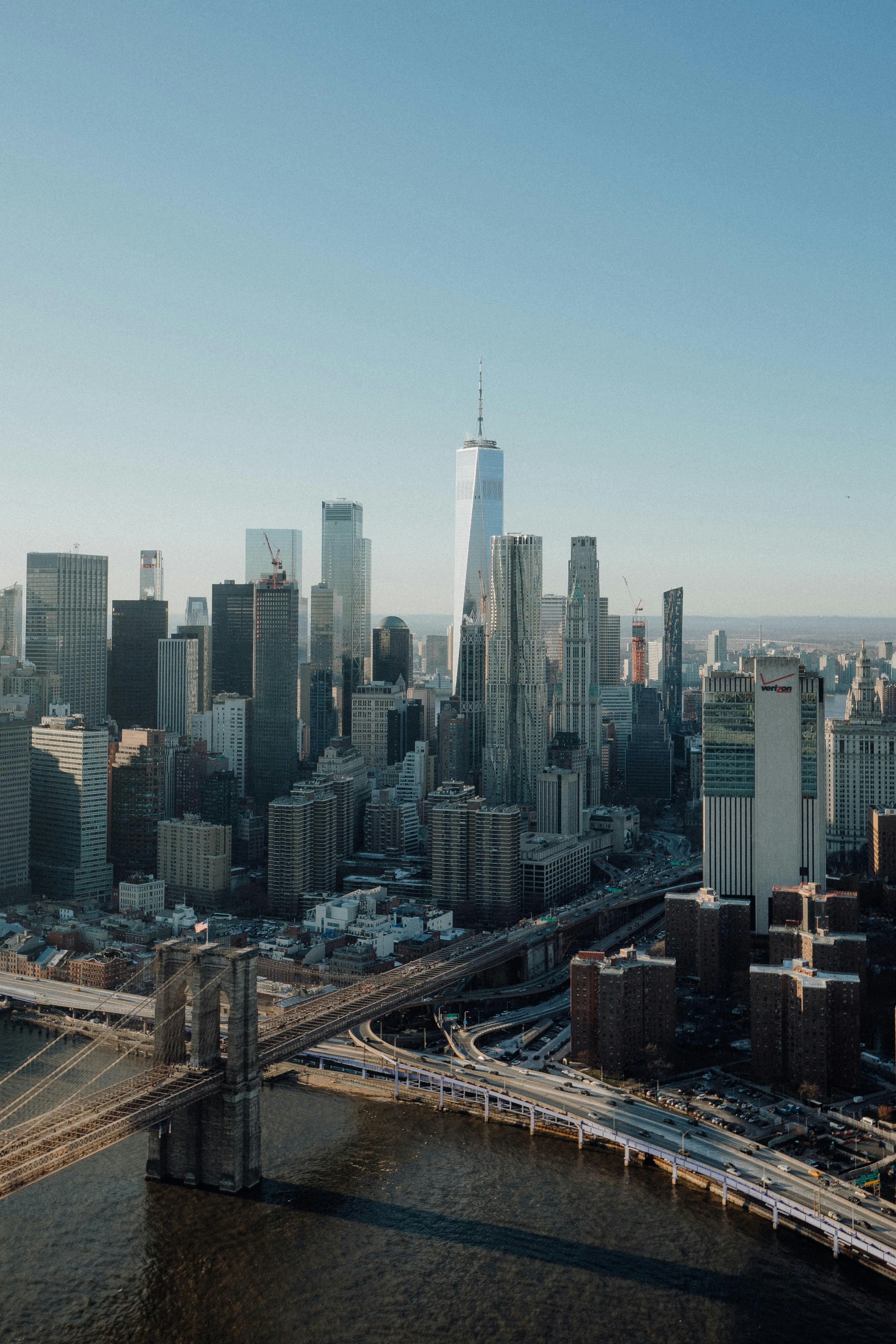an aerial view of a city and a bridge