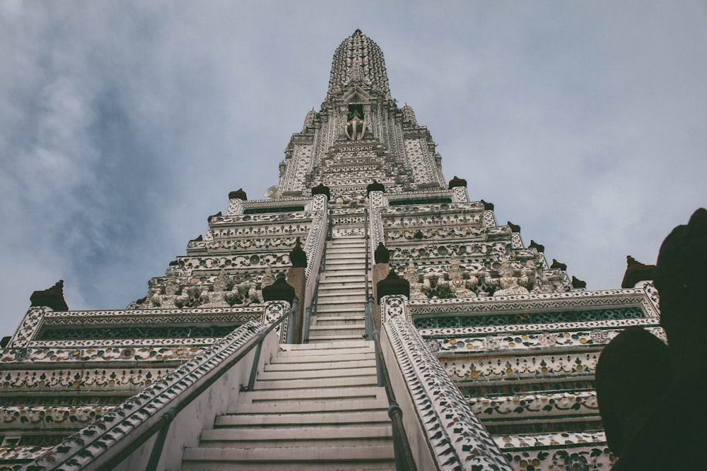 a very tall building with some stairs going up it