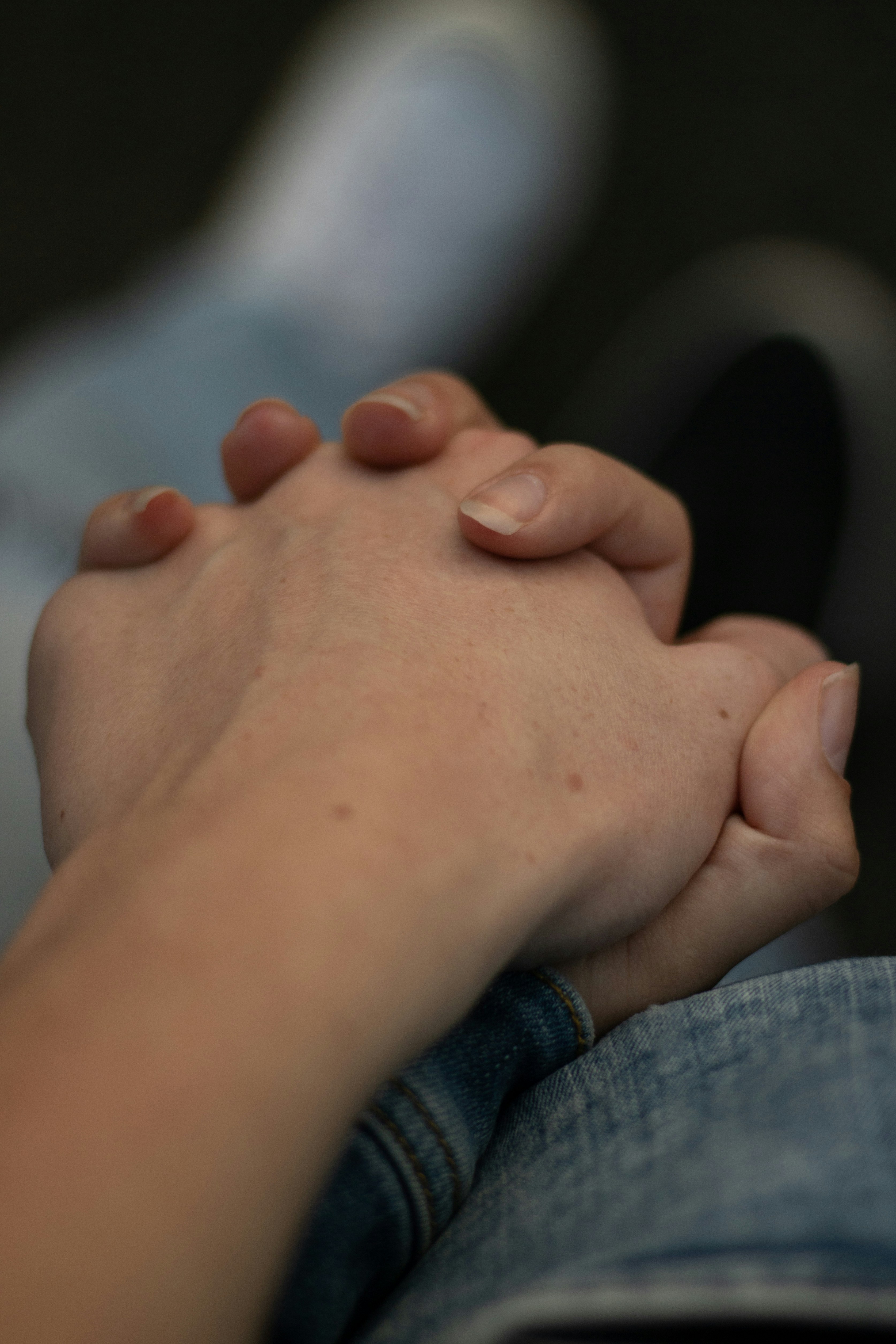 a close up of a person holding another person's hand