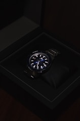 a watch sitting in a black box on a table