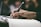 Close-up of hands holding a notebook and pen during a training session.