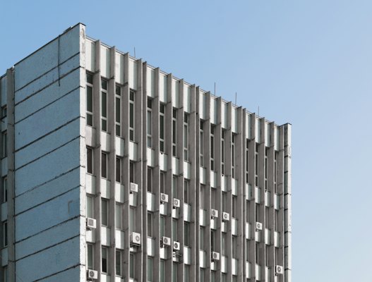 A tall building with lots of windows and a sky background — Chișinău, Moldova
