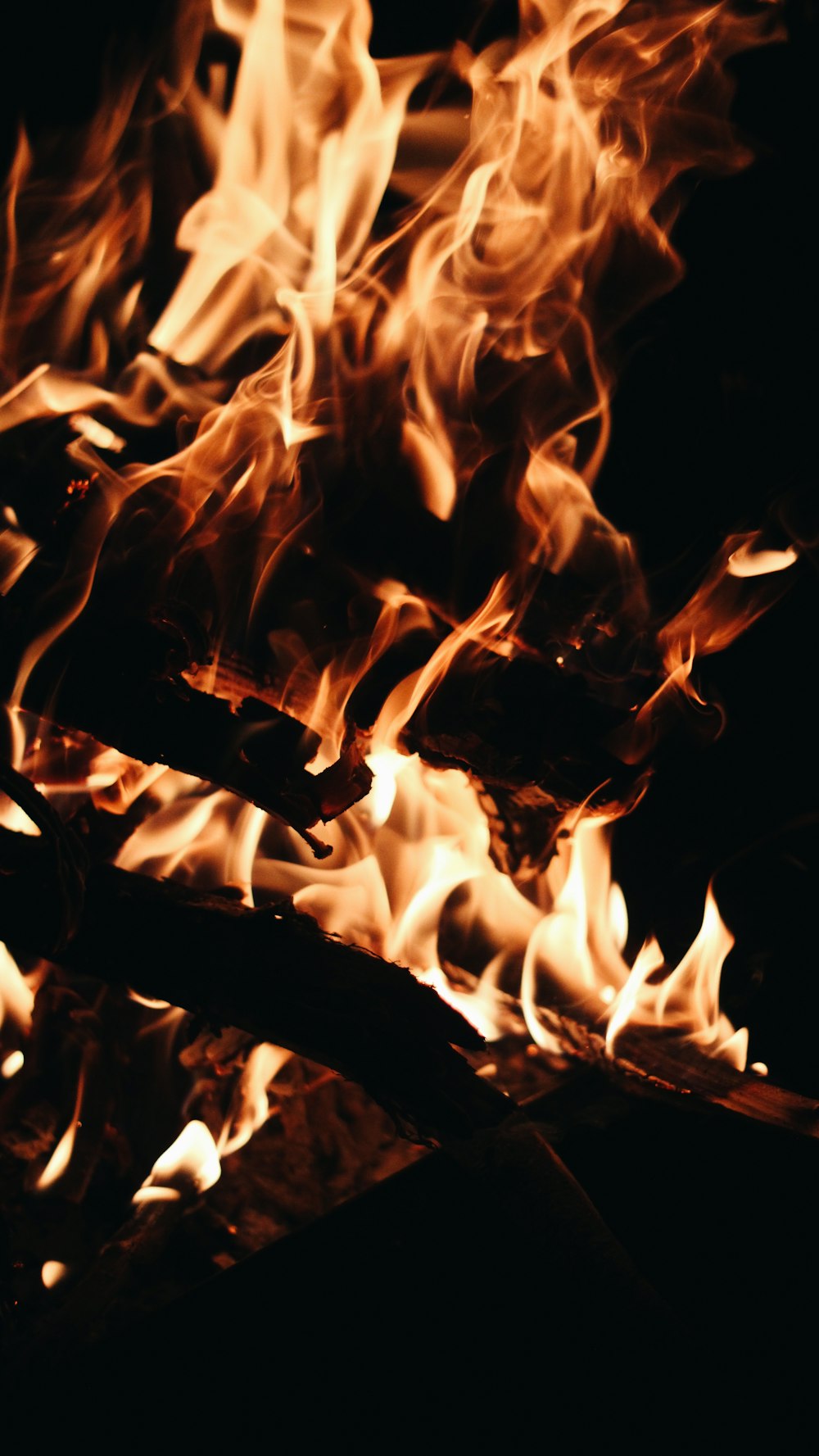 a close up of a fire in the dark