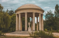 a gazebo with a statue in the middle of it