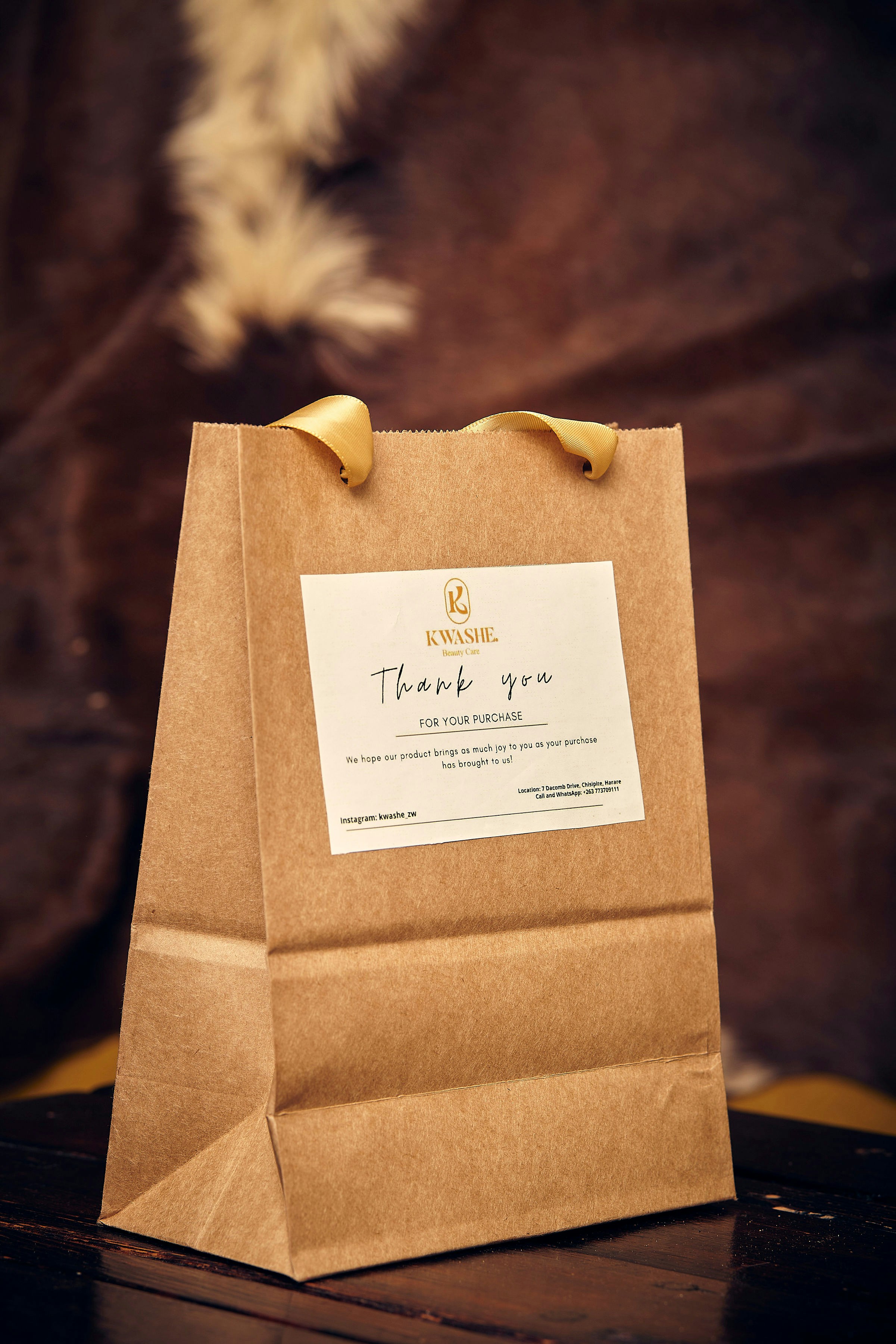 a brown paper bag sitting on top of a wooden table