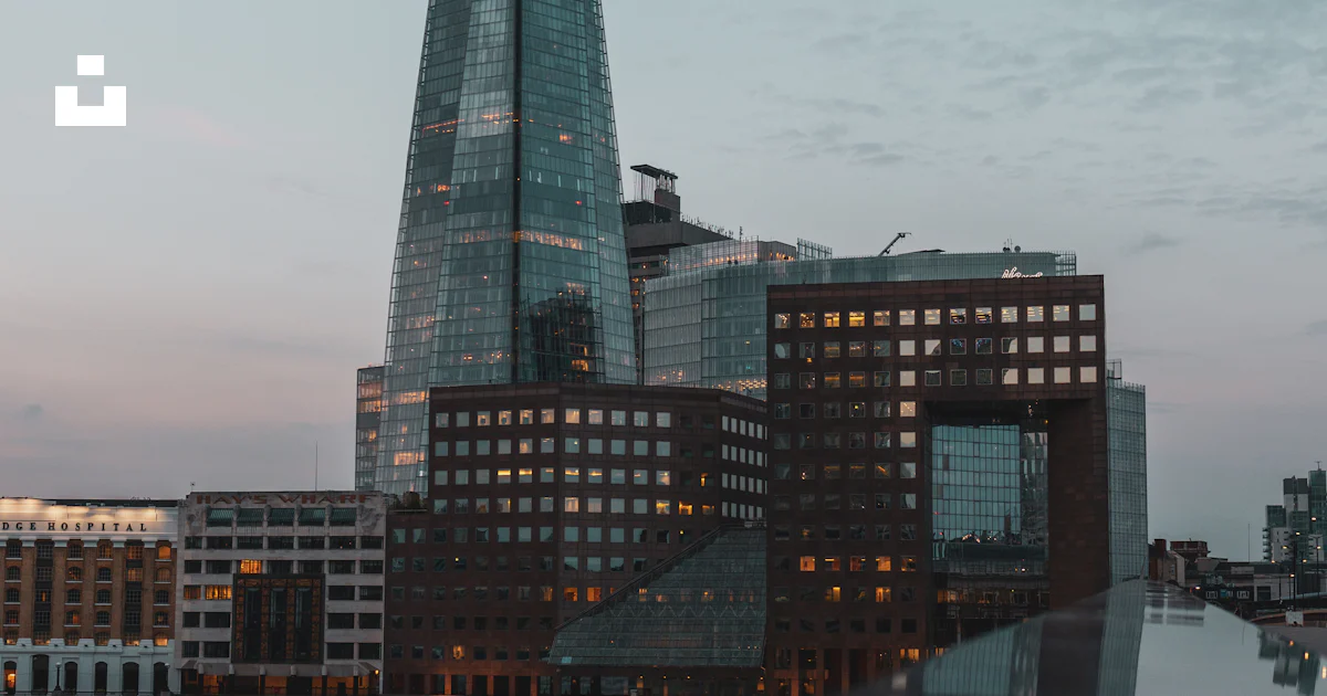 Splashed Buildings The shard of the building is reflected in the water photo – Free London ...