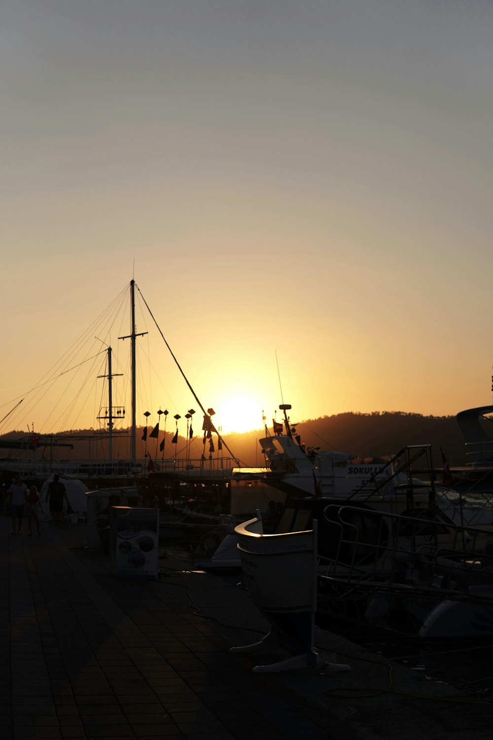 a group of boats sitting on top of a pier