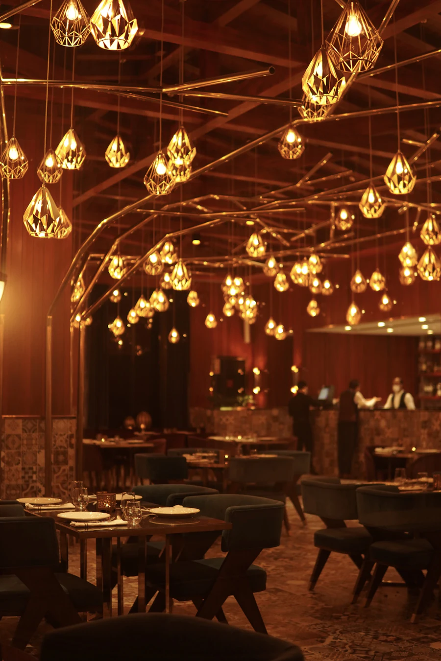 A restaurant with pendant lights hanging from the ceiling