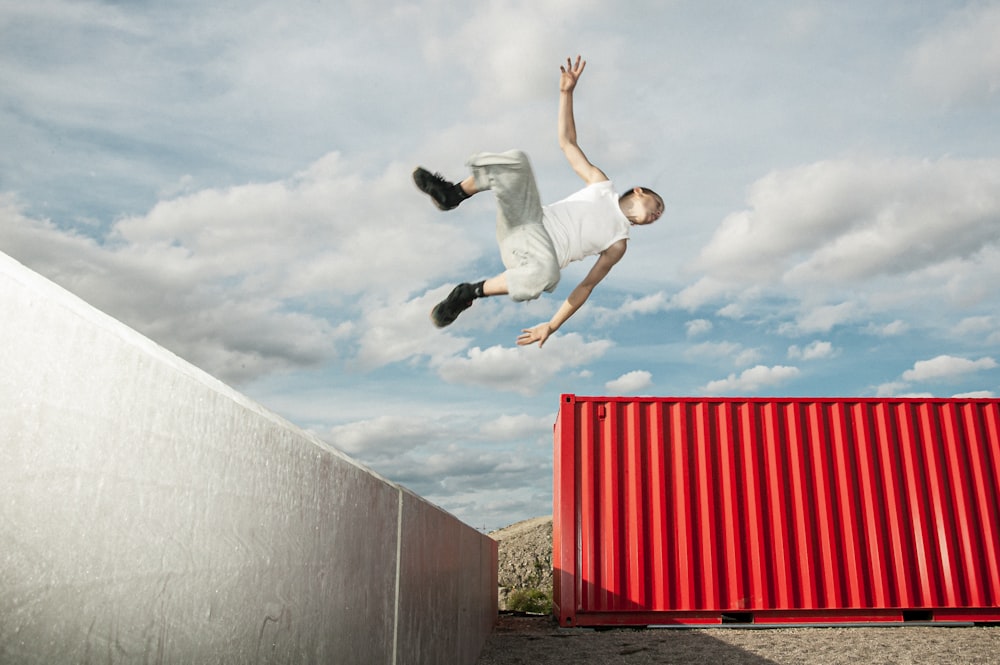 a man flying through the air while riding a skateboard