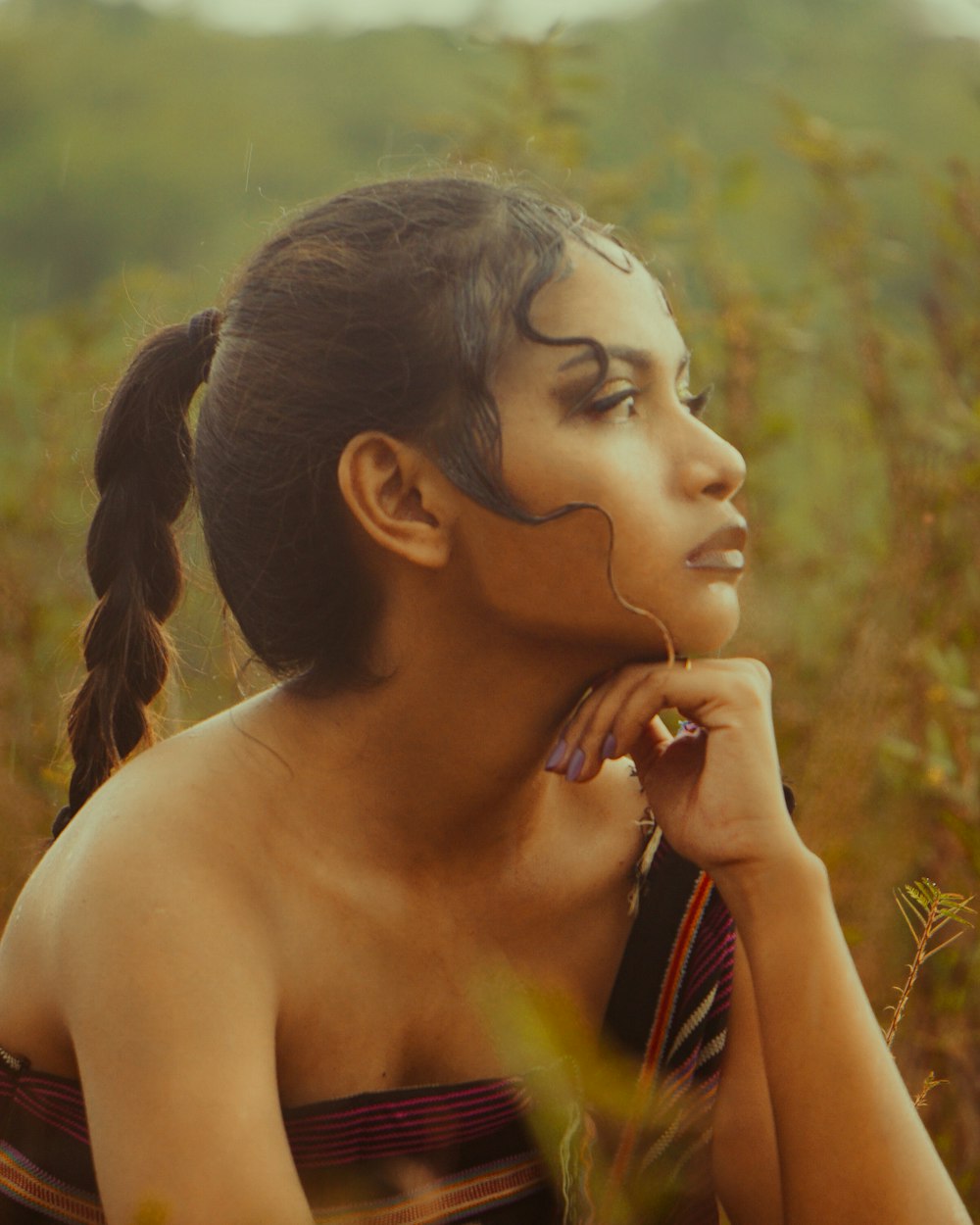 a woman with her hair in a pony tail