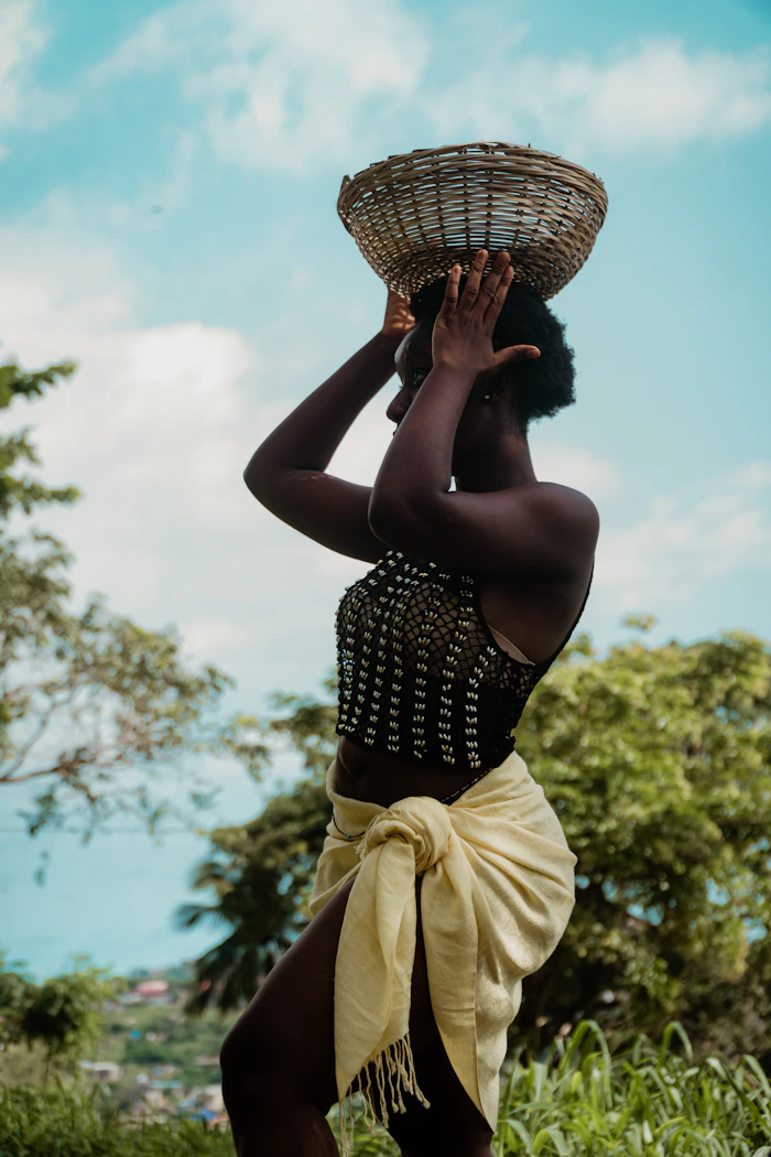 Farm worker carrying a harvest basket
