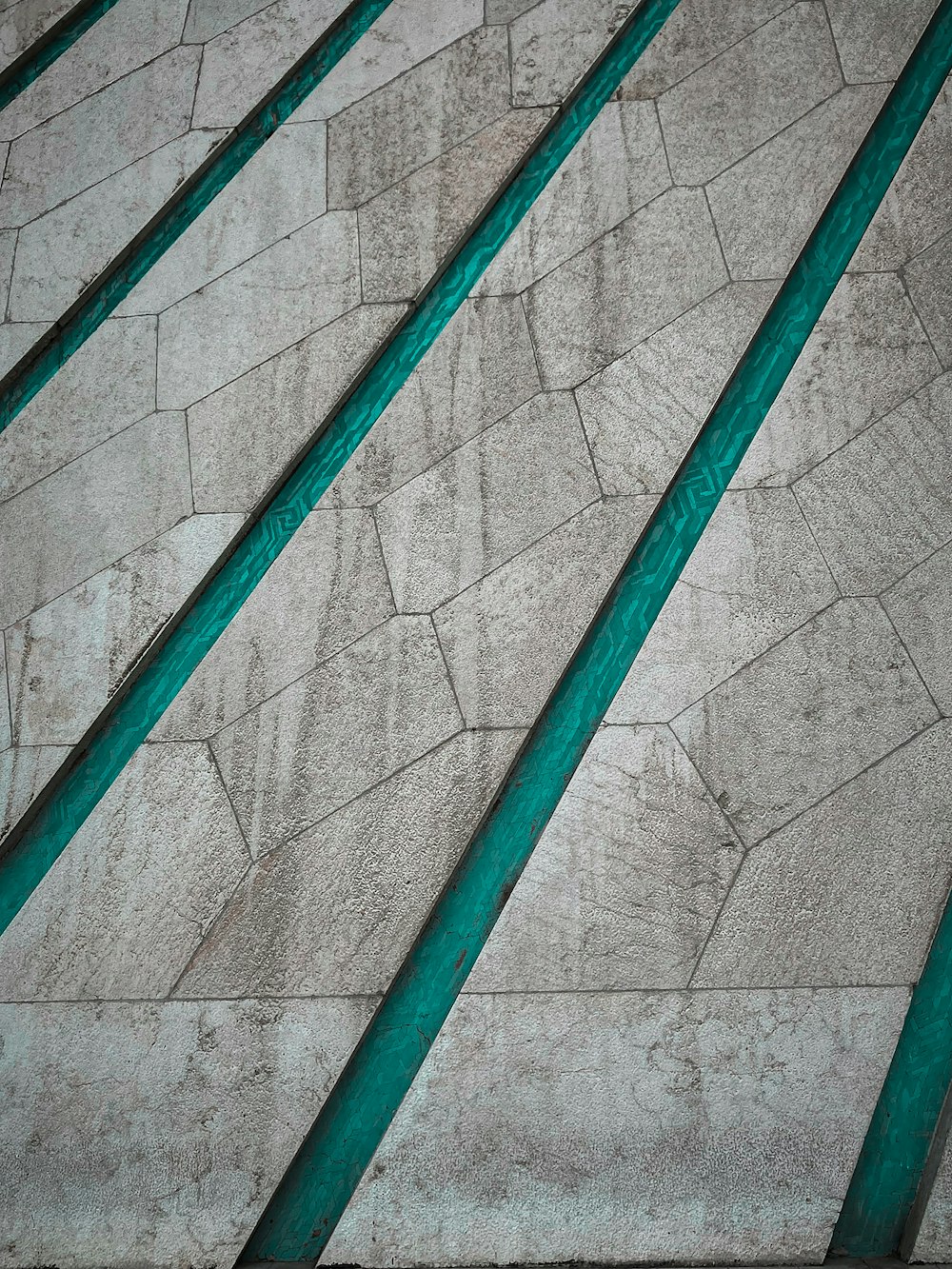 a close up of a wall with green metal bars