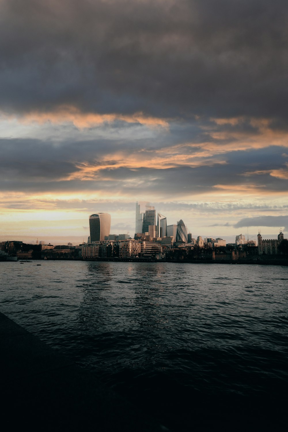 a large body of water with a city in the background