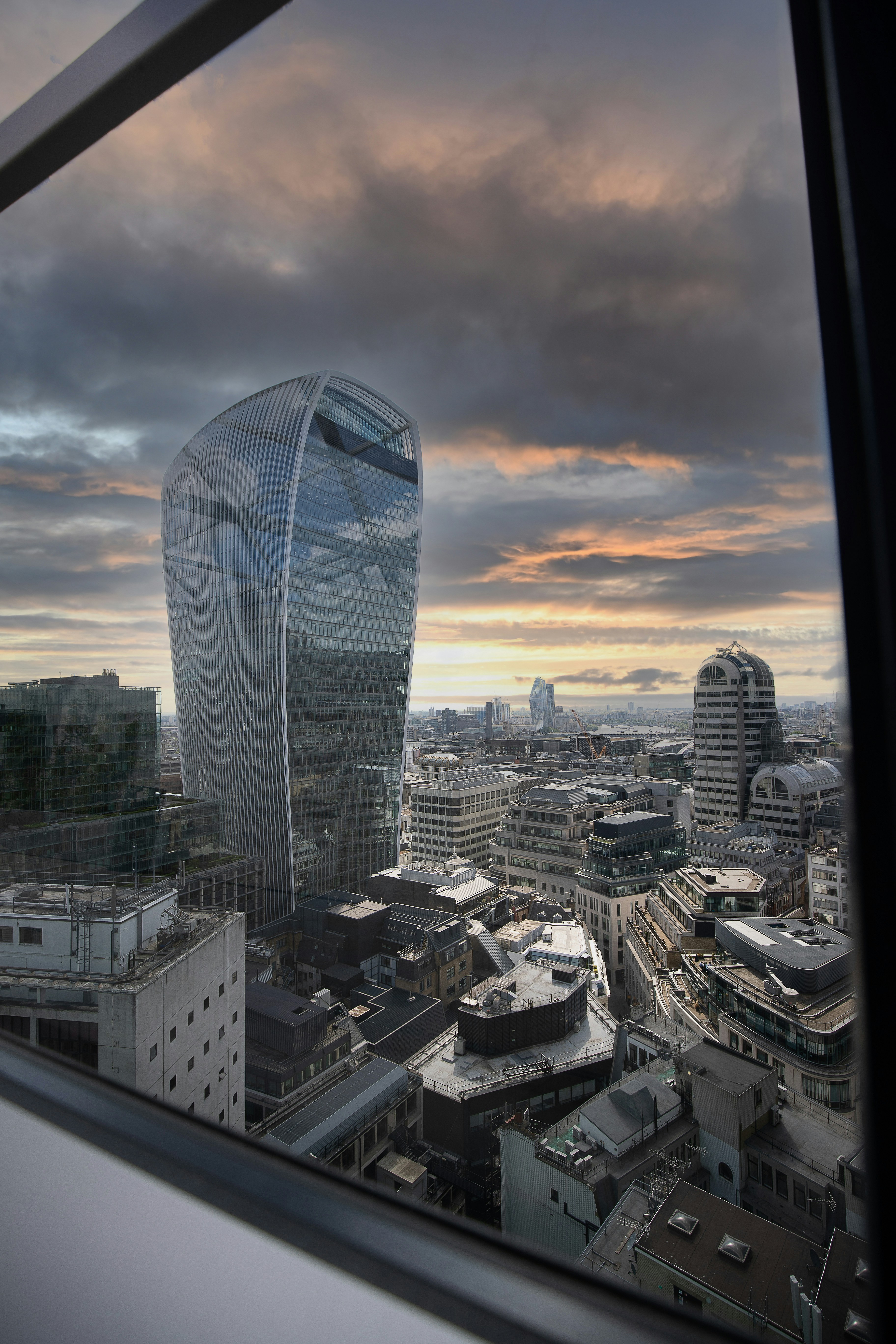 A view of a very tall building from a window photo – Free Street Image ...