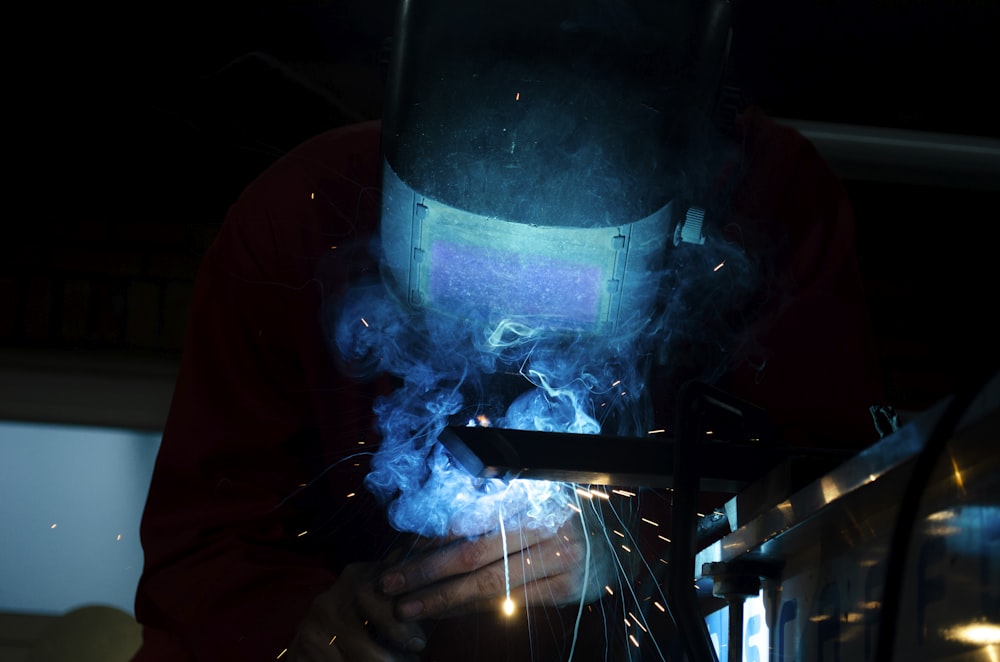 a welder working on a piece of metal