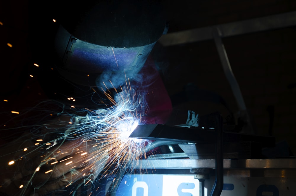 a welder working on a piece of metal