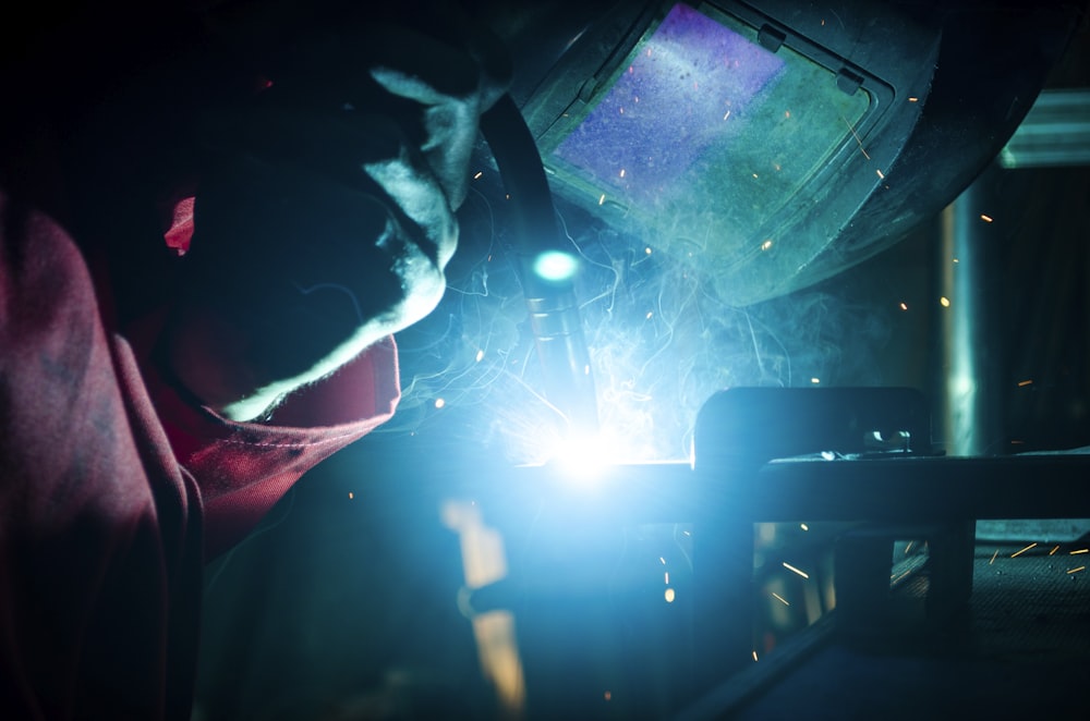 a welder working on a piece of metal