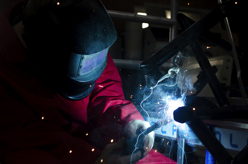 a welder working on a piece of metal