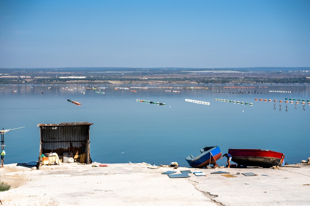 a group of boats sitting on top of a body of water