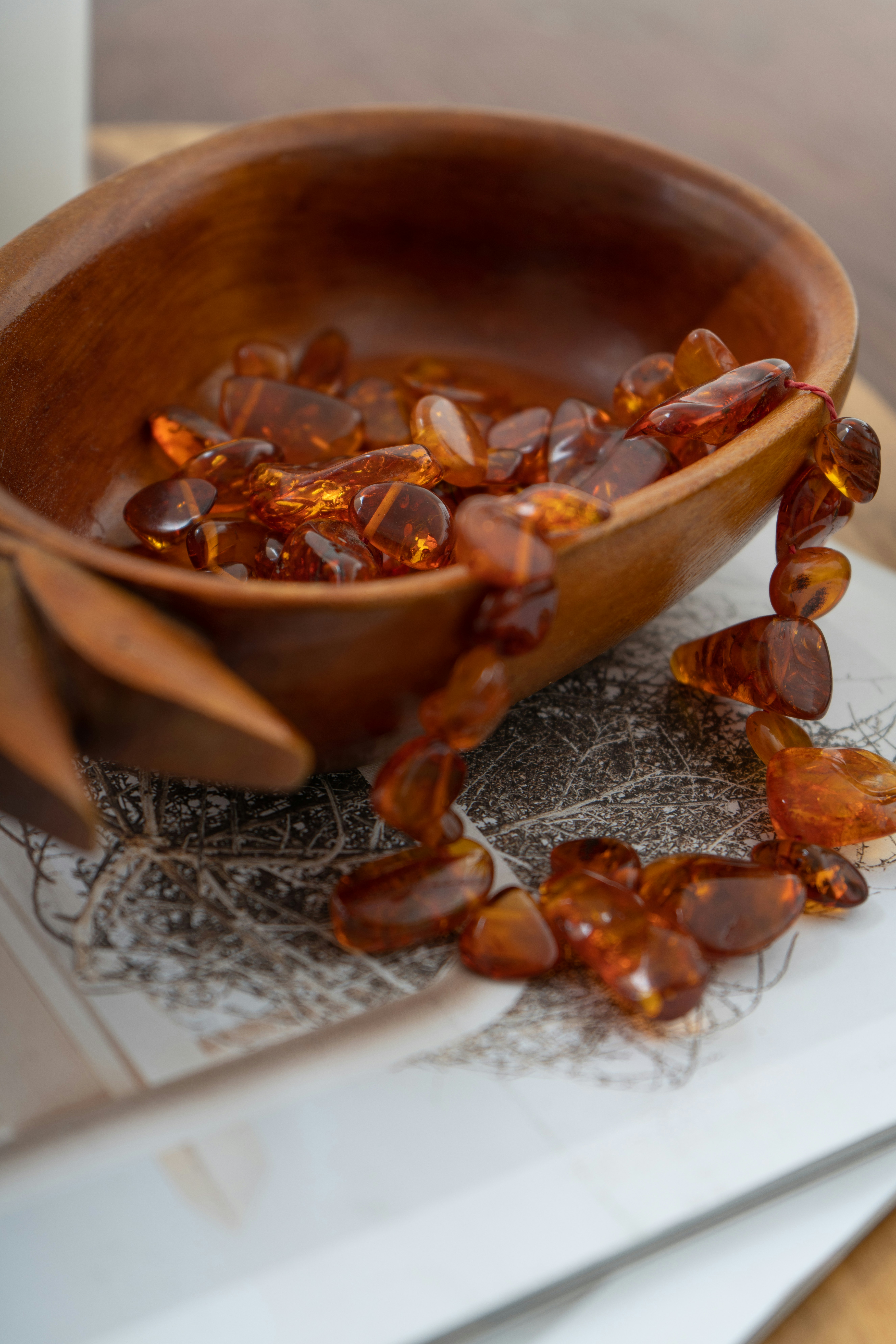 a wooden bowl filled with lots of glass shards
