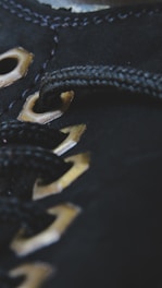 Close-up of detailed stitching on a modern activewear jacket.