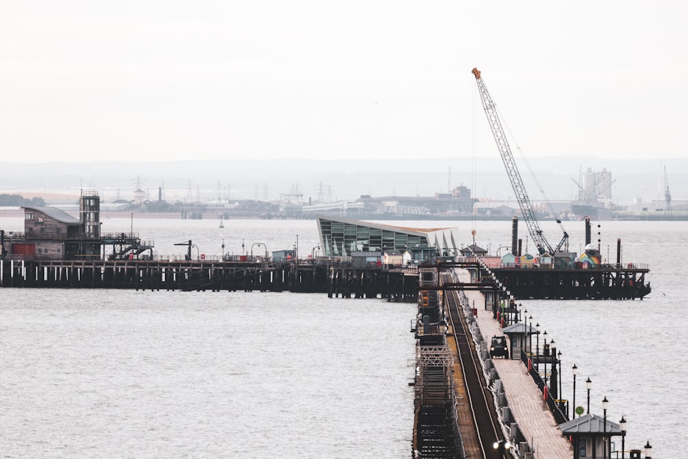 a large body of water next to a pier