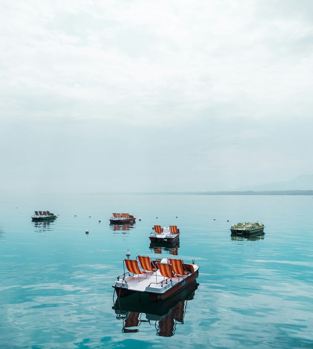 a number of small boats in a large body of water