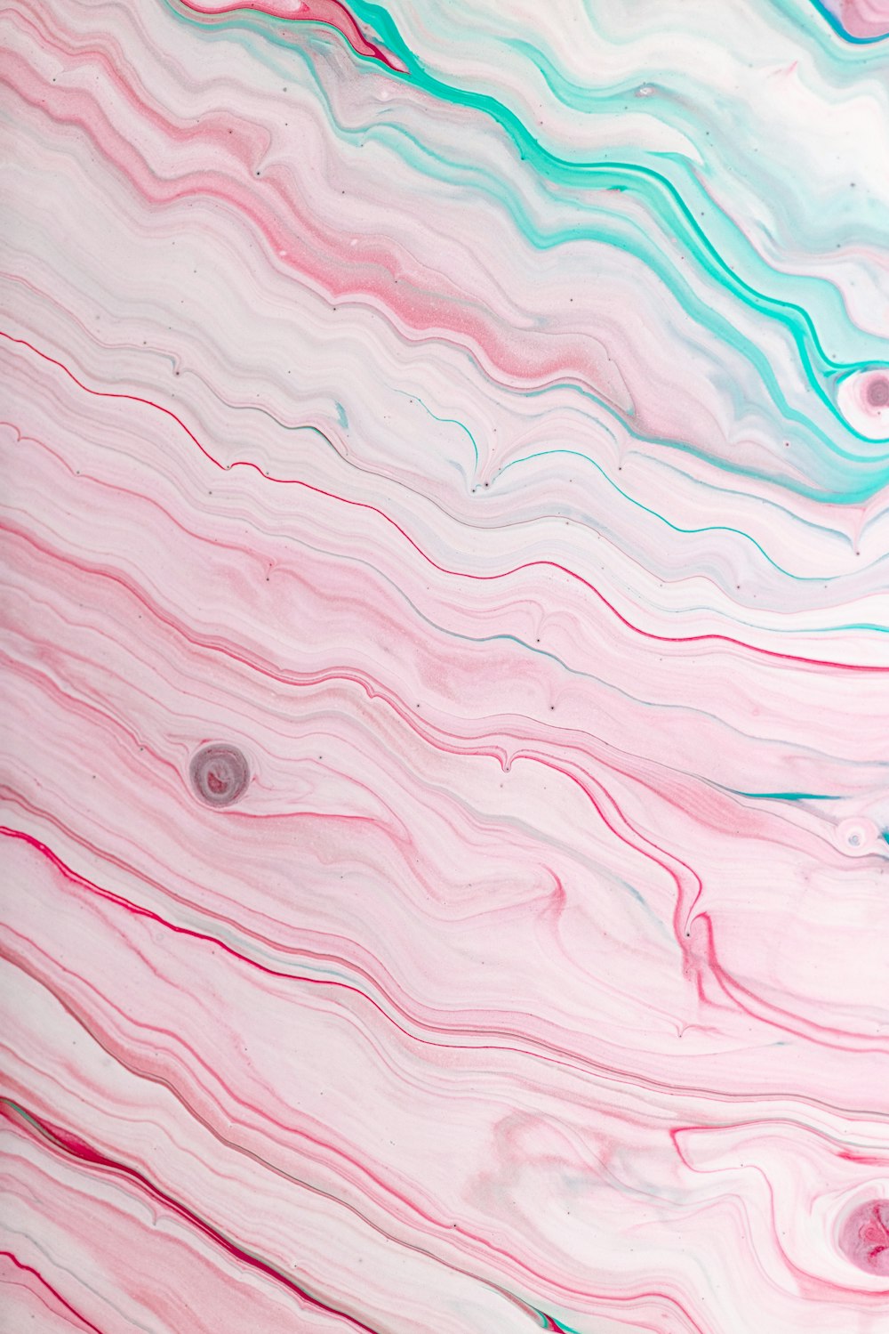 a pink and blue abstract painting with circles